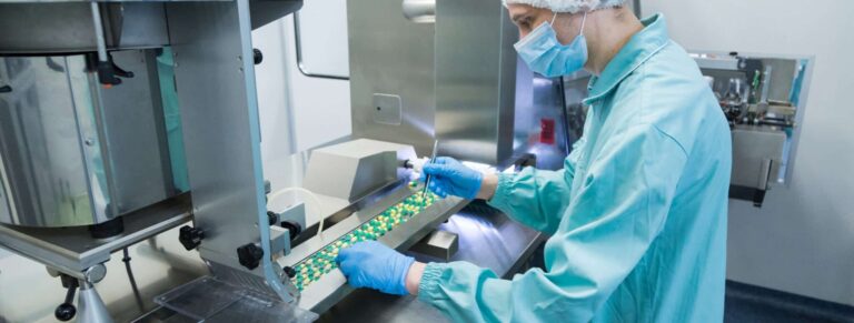 Pharmaceutical Industry Man Worker Protective Clothing Operating Production Tablets Sterile Working Conditions Scaled
